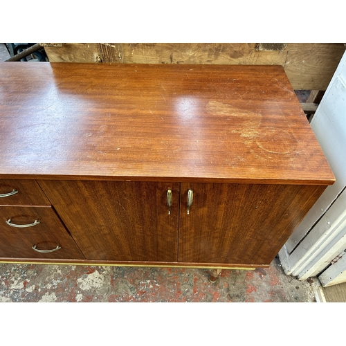 97 - A mid 20th century tola wood sideboard - approx. 74cm high x 183cm wide x 46cm deep