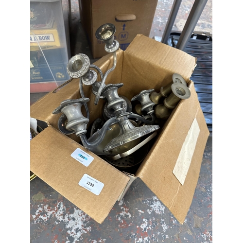 1230 - A collection of items to include two silver plated three branch candelabras, pair of brass candle st... 