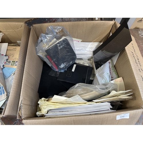 1243 - Two boxes containing a large collection of loose stamps first day covers