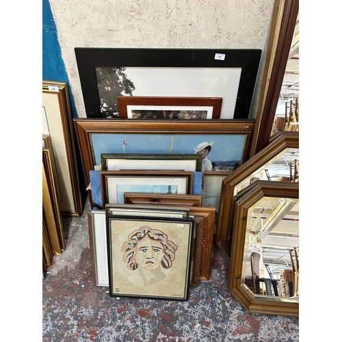 256 - A collection of pictures and mirrors to include two pine framed octagonal wall mirrors, 1960s mosaic... 