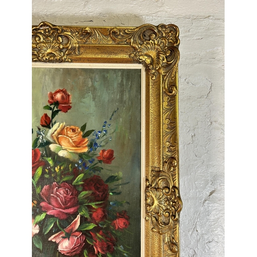 258 - A gilt framed floral still life oil on canvas signed A. Debeuf - approx. 88cm high x 67cm wide