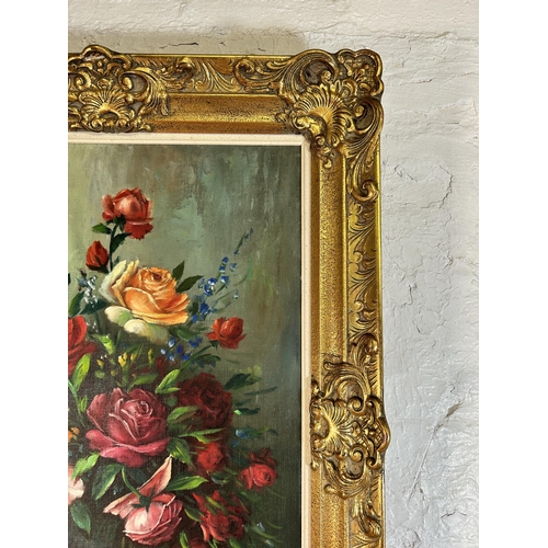 258 - A gilt framed floral still life oil on canvas signed A. Debeuf - approx. 88cm high x 67cm wide