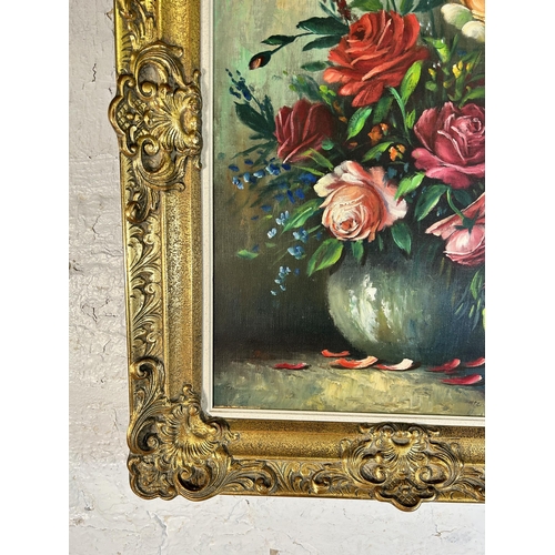 258 - A gilt framed floral still life oil on canvas signed A. Debeuf - approx. 88cm high x 67cm wide