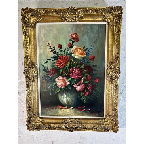 258 - A gilt framed floral still life oil on canvas signed A. Debeuf - approx. 88cm high x 67cm wide