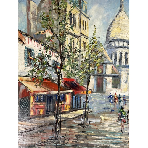 260 - A gilt framed oil on canvas of a Parisian scene - approx. 51cm high x 60cm wide