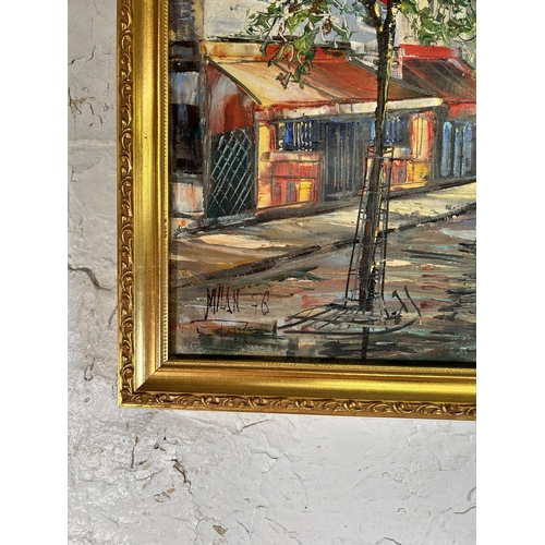 260 - A gilt framed oil on canvas of a Parisian scene - approx. 51cm high x 60cm wide