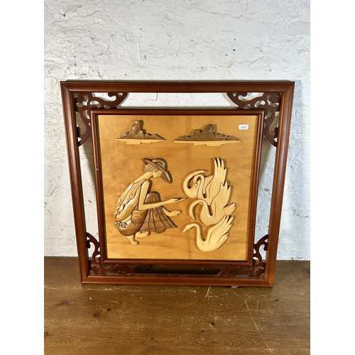 261 - An Oriental carved wooden wall hanging - approx. 60cm high x 60cm wide