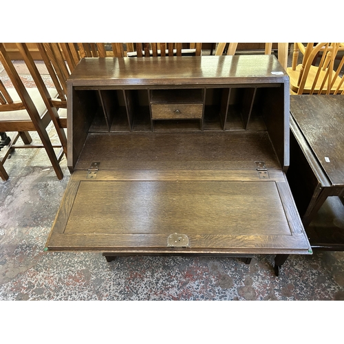 122 - A carved oak linenfold bureau - approx. 93cm high x 76cm wide x 42cm deep