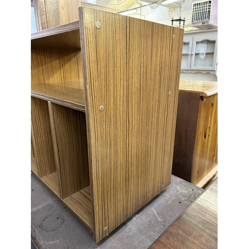 132 - A mid 20th century teak effect record cabinet on casters - approx. 61cm high x 58cm wide x 38cm deep