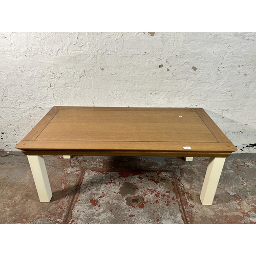 143 - A modern solid oak and white painted coffee table