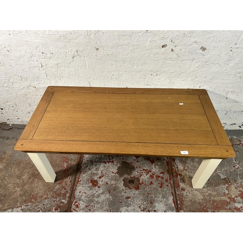 143 - A modern solid oak and white painted coffee table