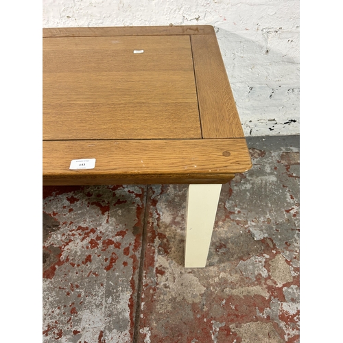 143 - A modern solid oak and white painted coffee table