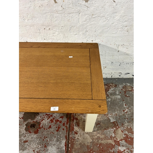 143 - A modern solid oak and white painted coffee table