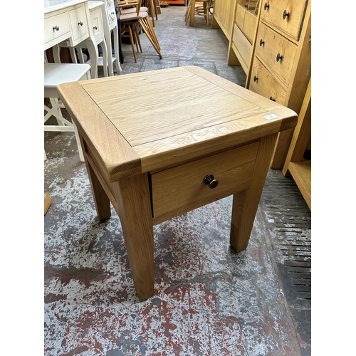 144 - A modern solid oak side table - approx. 61cm high x 55cm wide x 55cm deep