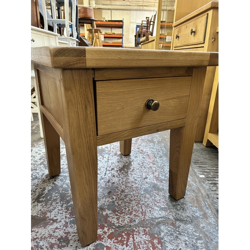 144 - A modern solid oak side table - approx. 61cm high x 55cm wide x 55cm deep