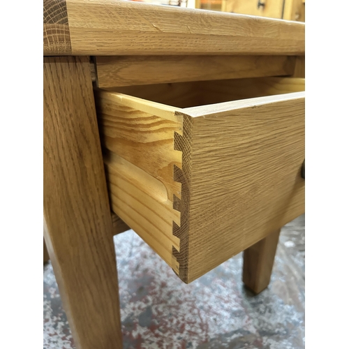 144 - A modern solid oak side table - approx. 61cm high x 55cm wide x 55cm deep