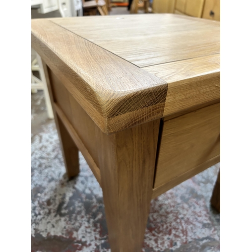 144 - A modern solid oak side table - approx. 61cm high x 55cm wide x 55cm deep