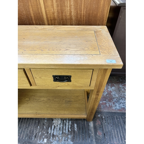 145 - A modern solid oak console table - approx. 76cm high x 85cm wide x 35cm deep