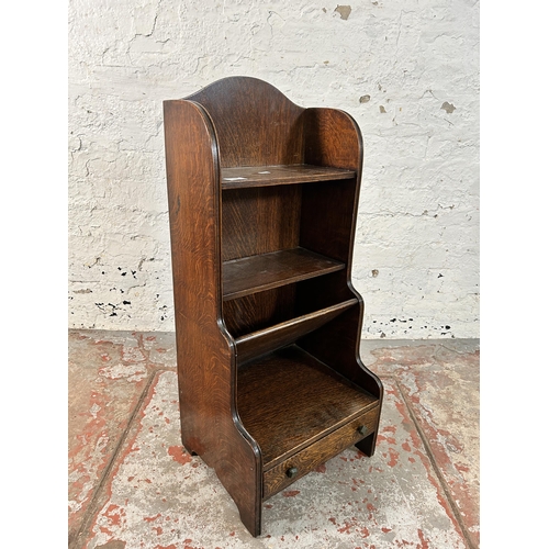 146 - An oak waterfall bookcase - approx. 81cm high x 35cm wide x 30cm deep