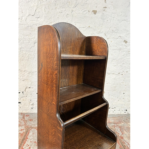 146 - An oak waterfall bookcase - approx. 81cm high x 35cm wide x 30cm deep