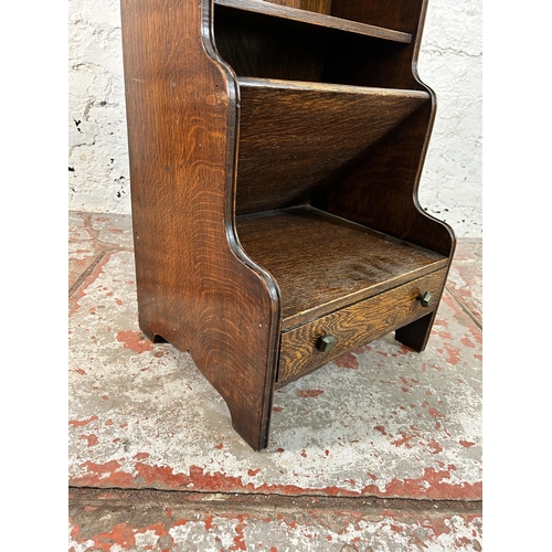 146 - An oak waterfall bookcase - approx. 81cm high x 35cm wide x 30cm deep