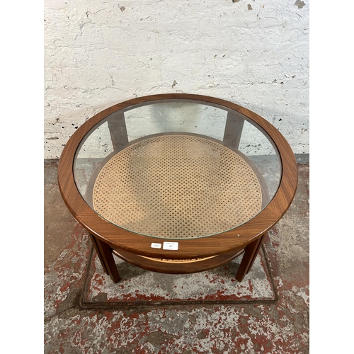 72 - A 1970s G Plan teak and cane circular two tier coffee table with glass top - approx. 44cm high x 82c... 