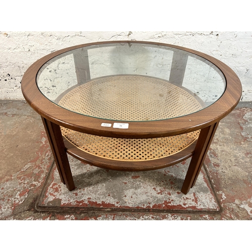 72 - A 1970s G Plan teak and cane circular two tier coffee table with glass top - approx. 44cm high x 82c... 