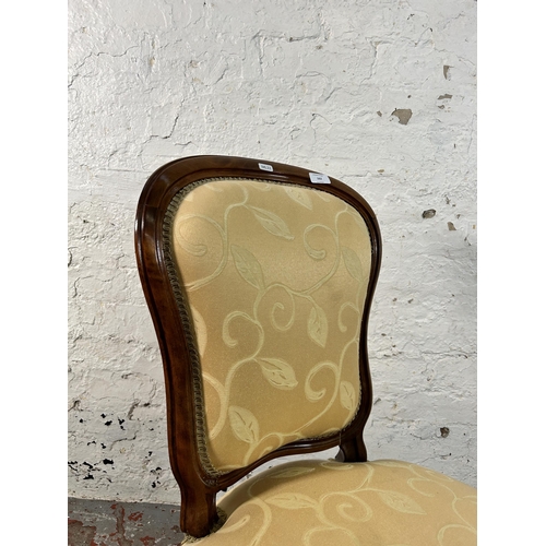 162 - A Victorian walnut and fabric upholstered nursing chair