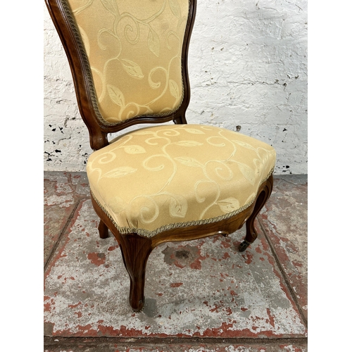 162 - A Victorian walnut and fabric upholstered nursing chair