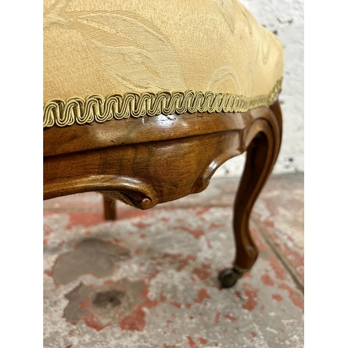 162 - A Victorian walnut and fabric upholstered nursing chair