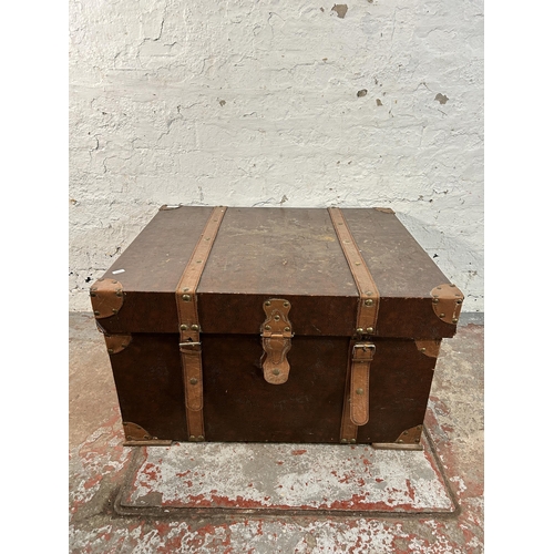 163 - An antique style brown faux leather travel trunk coffee table