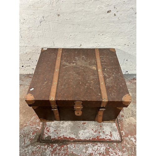 163 - An antique style brown faux leather travel trunk coffee table