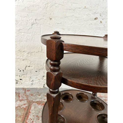 164 - An oak three tier drinks trolley - approx. 67cm high x 47cm diameter