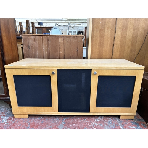 165 - A modern beech and blue fabric TV stand - approx. 61cm high x 133cm wide x 48cm deep