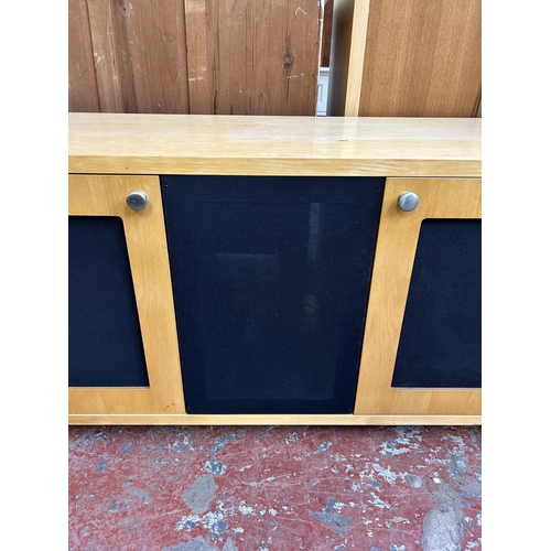 165 - A modern beech and blue fabric TV stand - approx. 61cm high x 133cm wide x 48cm deep