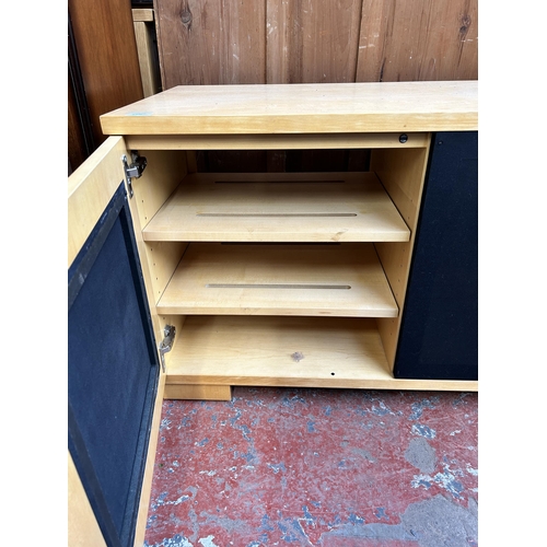 165 - A modern beech and blue fabric TV stand - approx. 61cm high x 133cm wide x 48cm deep