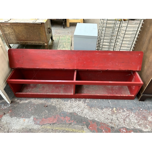 177 - A mid 20th century red painted wooden shoe bench - approx. 34cm high x 157cm wide x 30cm deep