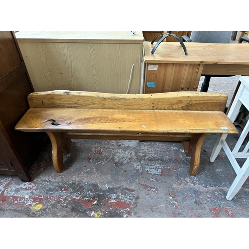 179 - An oak tree slice bench - approx. 59cm high x 139cm wide x 29cm deep