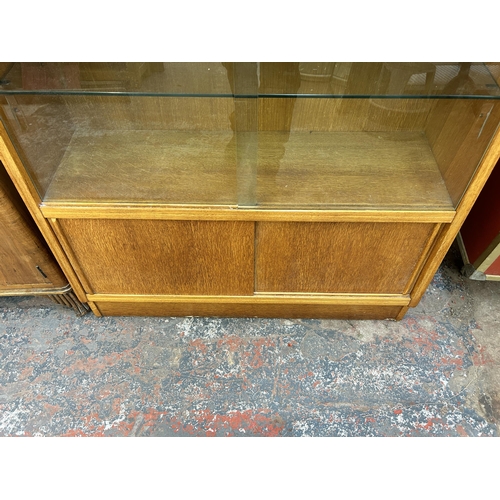 189 - A 1950s G Plan Brandon oak bookcase - approx. 85cm high x 91cm wide x 43cm deep