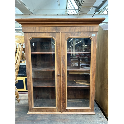 192 - A Victorian mahogany two door glazed bookcase - approx. 104cm high x 79cm wide x 27cm deep