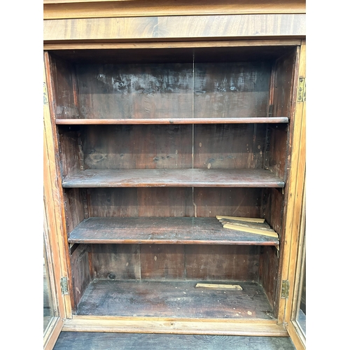 192 - A Victorian mahogany two door glazed bookcase - approx. 104cm high x 79cm wide x 27cm deep