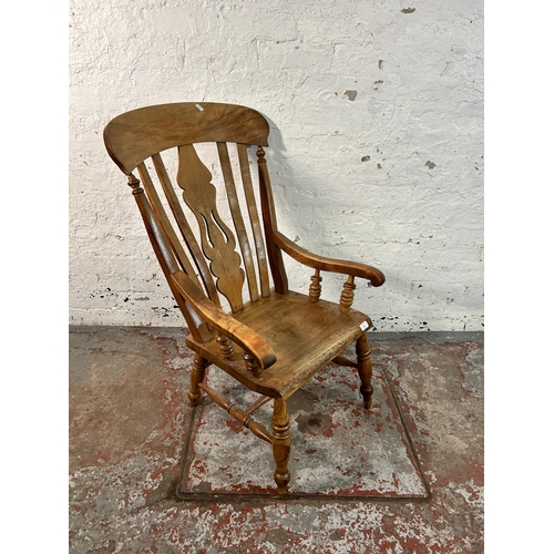 194 - A Victorian elm and beech farmhouse armchair