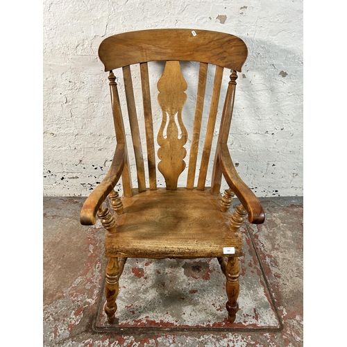 194 - A Victorian elm and beech farmhouse armchair