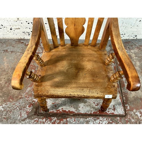 194 - A Victorian elm and beech farmhouse armchair