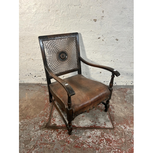 207 - A mid 20th century beech and brown leather rattan back bergere armchair