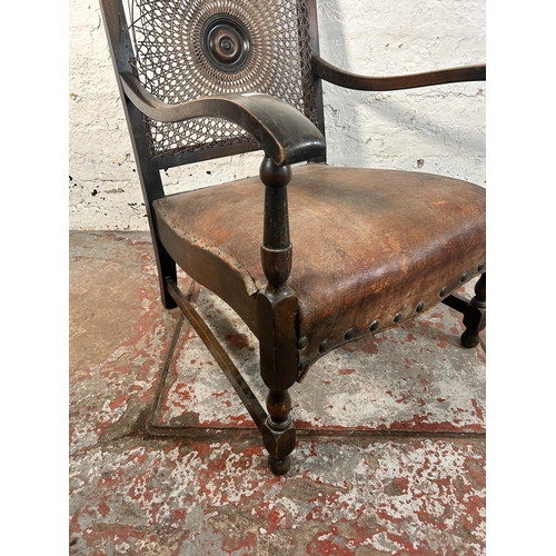 207 - A mid 20th century beech and brown leather rattan back bergere armchair