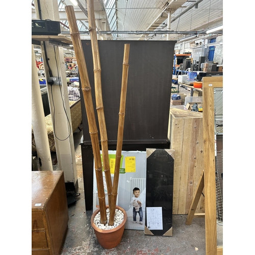 208 - Three items, one B&Q floating shelf, one Mothercare wall fix metal gate and one terracotta planter c... 