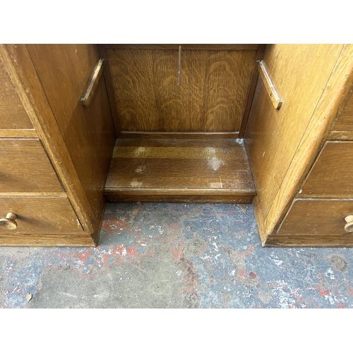 209 - A mid 20th century Vesper Furniture oak dressing table