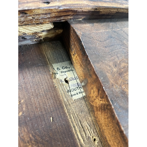 211 - A walnut and marquetry inlaid tripod occasional table - approx. 70cm high x 60cm diameter