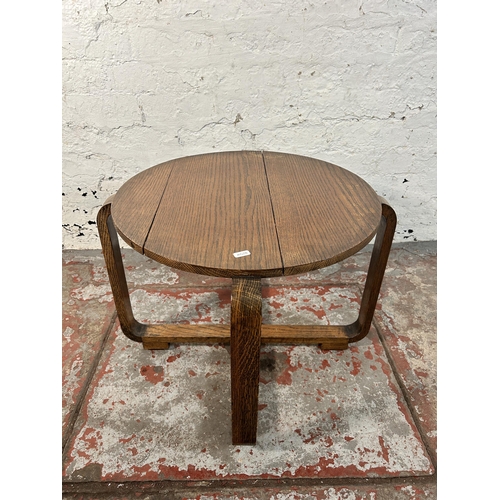 212 - An Art Deco oak side table - approx. 43cm high x 52cm diameter